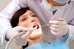 woman examined by dentist