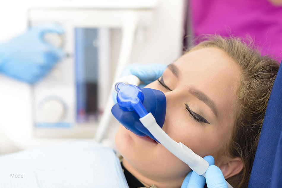  A woman receives sedation for her dental procedure.